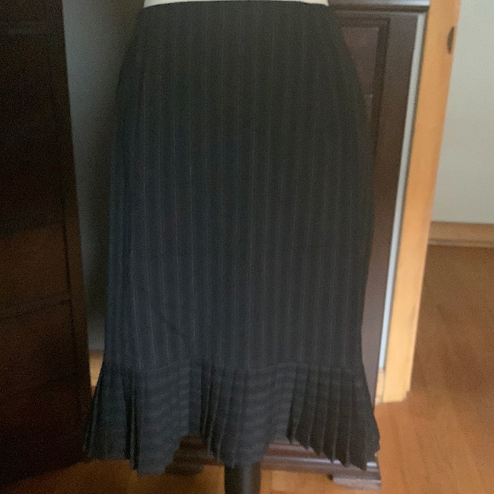 Knee length skirt with adorable little pleats in hemline